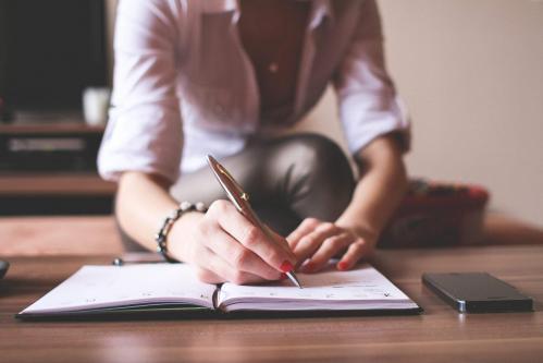 Girl writing in a diary free stock photos picjumbo img 6037 2210x1473